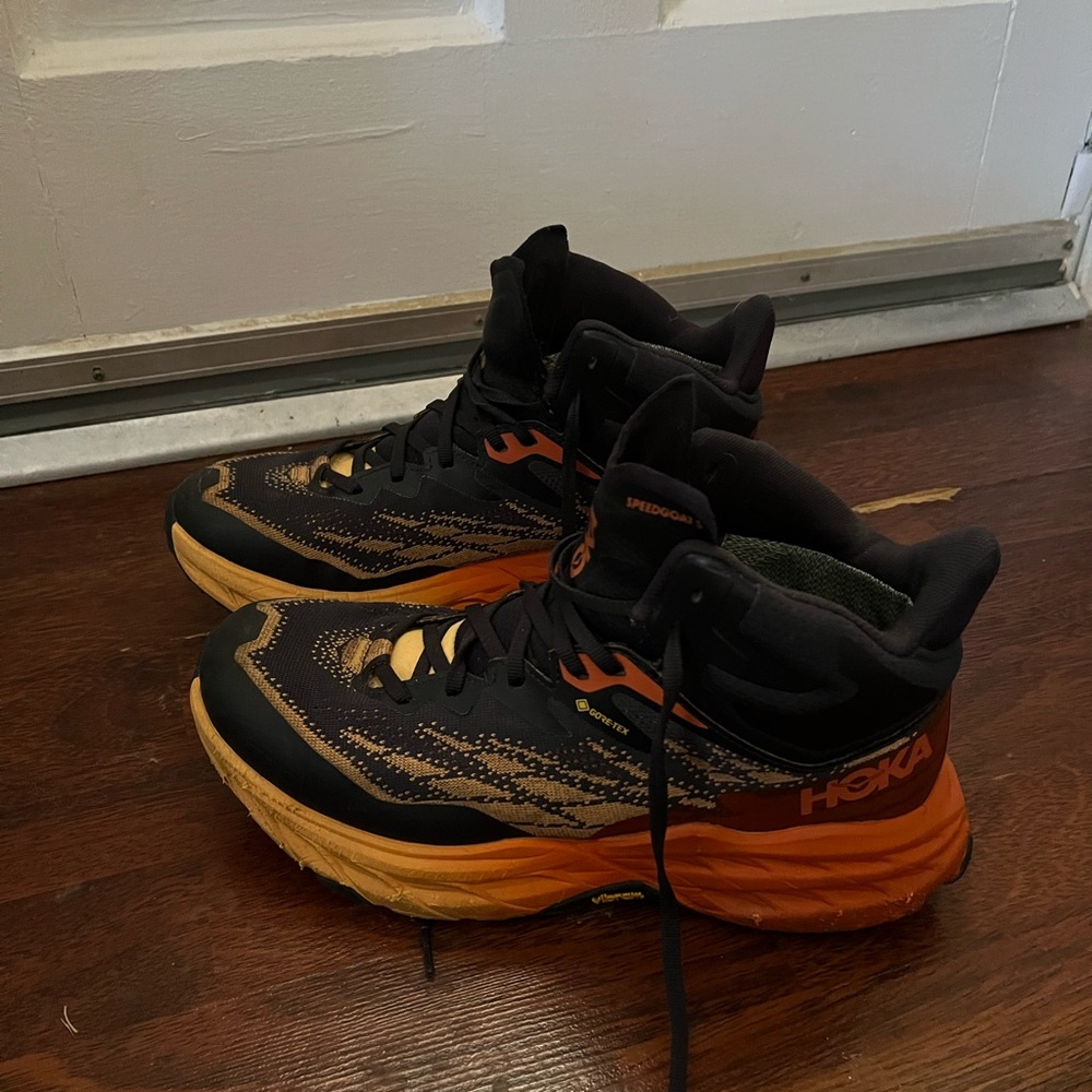 Hoka Black and Orange Athletic Shoes
